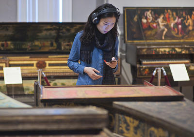 Visitor at the Collection taking an audio tour.