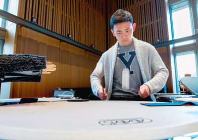 Student playing timpani